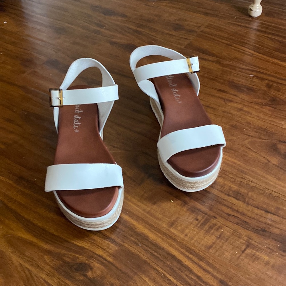 White sandals with a slight platform
